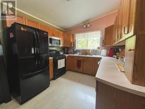 210 Belmond Road, Salmo, BC - Indoor Photo Showing Kitchen With Double Sink