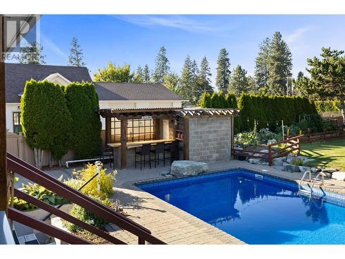 3374 Larkspur Court, Kelowna, BC - Outdoor With In Ground Pool With Deck Patio Veranda With Backyard