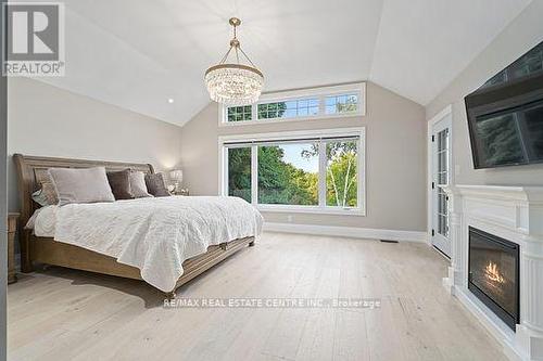 14097 Sixth Line, Halton Hills, ON - Indoor Photo Showing Bedroom With Fireplace