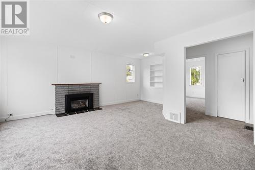 2498 Rosstown Rd, Nanaimo, BC - Indoor Photo Showing Other Room With Fireplace