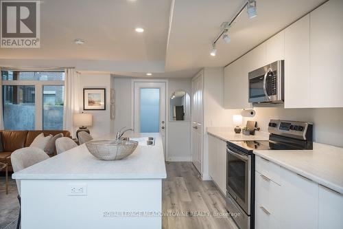 106 - 3058 Sixth Line, Oakville, ON - Indoor Photo Showing Kitchen With Stainless Steel Kitchen With Double Sink