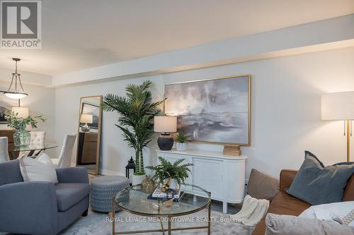 106 - 3058 Sixth Line, Oakville, ON - Indoor Photo Showing Living Room With Fireplace