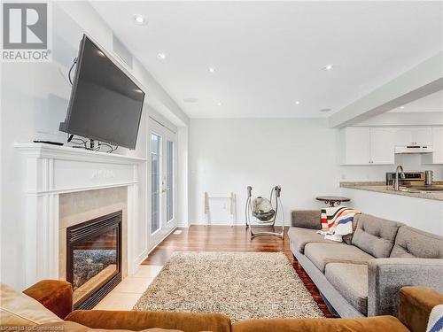 56 Geranium Avenue, Hamilton, ON - Indoor Photo Showing Living Room With Fireplace