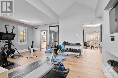 Main floor primary suite converted to an extensive gym off the den and ensuite - 144 Kerry Hill Crescent, Ottawa, ON - Indoor Photo Showing Gym Room