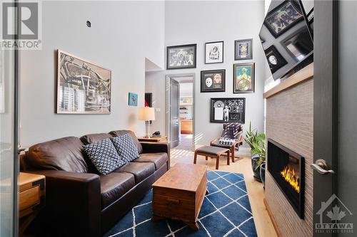 Den/sitting room with gas fireplace in the main floor primary bedroom suite - 144 Kerry Hill Crescent, Ottawa, ON - Indoor Photo Showing Living Room With Fireplace