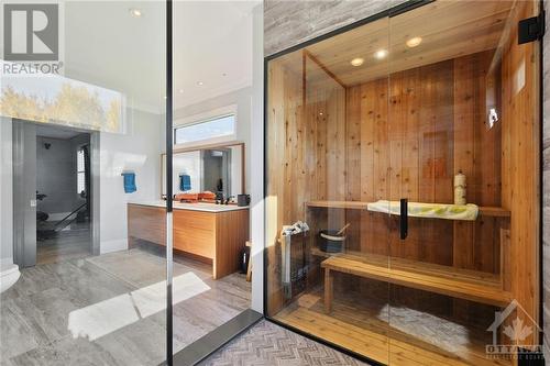 Ensuite with sauna and walk-in glass shower stall, double sink vanity - 144 Kerry Hill Crescent, Ottawa, ON - Indoor Photo Showing Other Room