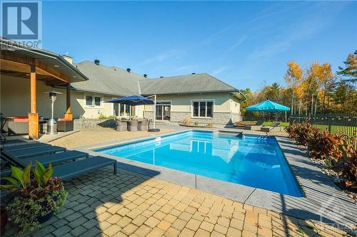 Large pool deck for entertaining and lounging in the sun or the shade - 144 Kerry Hill Crescent, Ottawa, ON - Outdoor With In Ground Pool With Deck Patio Veranda With Backyard