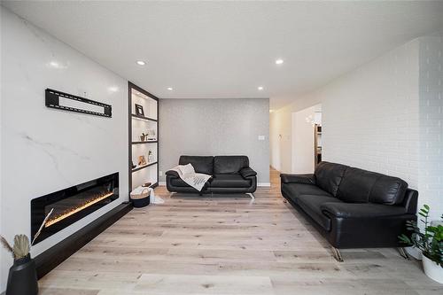 23 Gatineau Bay, Winnipeg, MB - Indoor Photo Showing Living Room With Fireplace