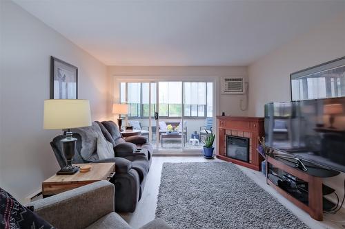 108-1170 Brookside Avenue, Kelowna, BC - Indoor Photo Showing Living Room With Fireplace