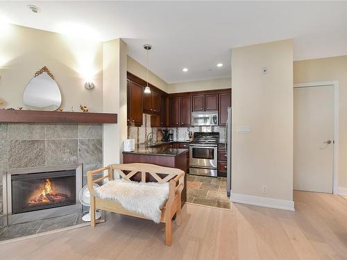 220-1325 Bear Mountain Pkwy, Langford, BC - Indoor Photo Showing Living Room With Fireplace