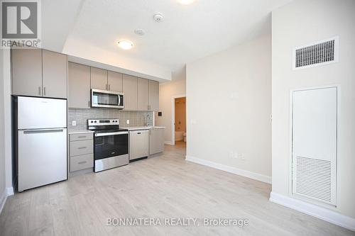 424 - 3220 William Coltson Avenue, Oakville, ON - Indoor Photo Showing Kitchen With Stainless Steel Kitchen