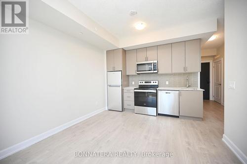 424 - 3220 William Coltson Avenue, Oakville, ON - Indoor Photo Showing Kitchen With Stainless Steel Kitchen