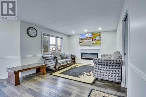 2490 Catalina Boulevard Ne, Calgary, AB - Indoor Photo Showing Living Room With Fireplace