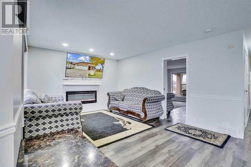 2490 Catalina Boulevard Ne, Calgary, AB - Indoor Photo Showing Living Room With Fireplace