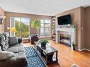 406-2511 Quadra St, Victoria, BC  - Indoor Photo Showing Living Room With Fireplace 