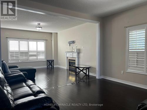 91 Earlsbridge Boulevard, Brampton, ON - Indoor Photo Showing Living Room With Fireplace