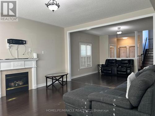 91 Earlsbridge Boulevard, Brampton, ON - Indoor Photo Showing Living Room With Fireplace