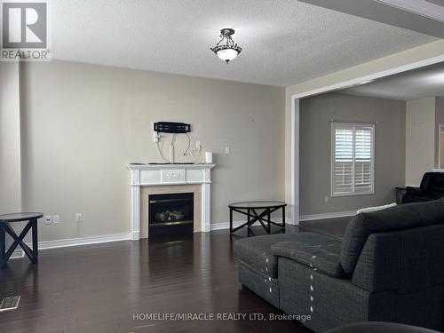 91 Earlsbridge Boulevard, Brampton, ON - Indoor Photo Showing Living Room With Fireplace