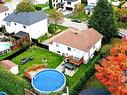 Vue - 66  - 66A Rue Des Tourterelles, Blainville, QC  - Outdoor With Above Ground Pool 