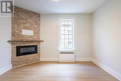 1 - 706 Waterloo Street, London, ON - Indoor Photo Showing Other Room With Fireplace