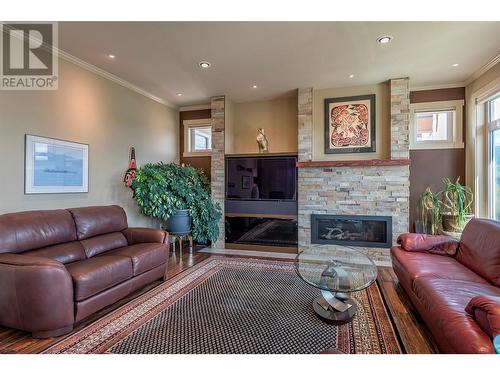 8883 Braeburn Drive, Coldstream, BC - Indoor Photo Showing Living Room With Fireplace