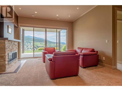 8883 Braeburn Drive, Coldstream, BC - Indoor Photo Showing Living Room With Fireplace