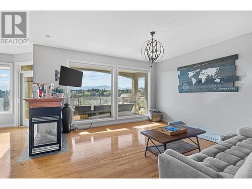 2061 Spyglass Way, Kelowna, BC - Indoor Photo Showing Living Room With Fireplace