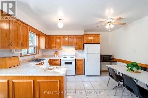 84 Wendake Road, Tiny, ON - Indoor Photo Showing Kitchen With Double Sink