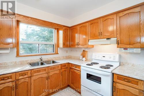 84 Wendake Road, Tiny, ON - Indoor Photo Showing Kitchen With Double Sink