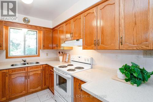 84 Wendake Road, Tiny, ON - Indoor Photo Showing Kitchen With Double Sink