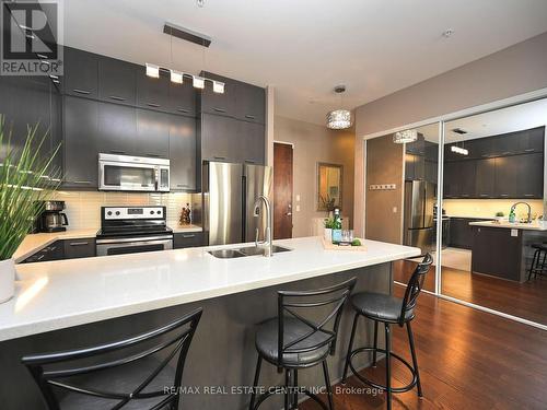 107 - 2480 Prince Michael Drive, Oakville, ON - Indoor Photo Showing Kitchen With Double Sink With Upgraded Kitchen