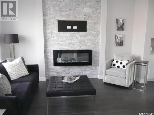 943 Brighton Gate, Saskatoon, SK - Indoor Photo Showing Living Room With Fireplace