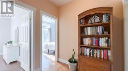 Hallway to the three bedrooms on the main floor. - 