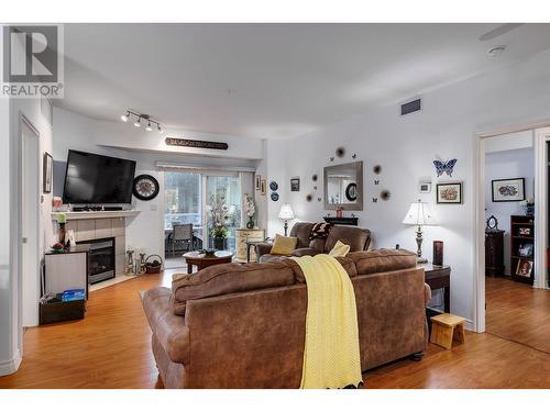 1961 Durnin Road Unit# 210, Kelowna, BC - Indoor Photo Showing Living Room With Fireplace