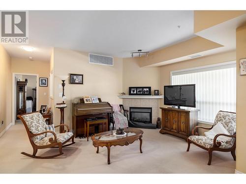 1961 Durnin Road Unit# 304, Kelowna, BC - Indoor With Fireplace