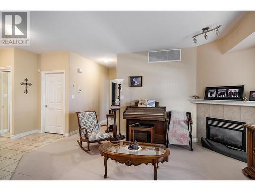 1961 Durnin Road Unit# 304, Kelowna, BC - Indoor Photo Showing Living Room With Fireplace