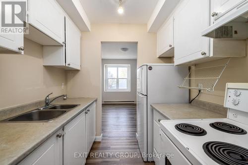 401 - 25 College Street E, Belleville, ON - Indoor Photo Showing Kitchen With Double Sink