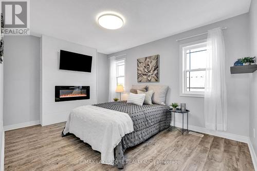 282 Strachan Street, Port Hope, ON - Indoor Photo Showing Bedroom With Fireplace