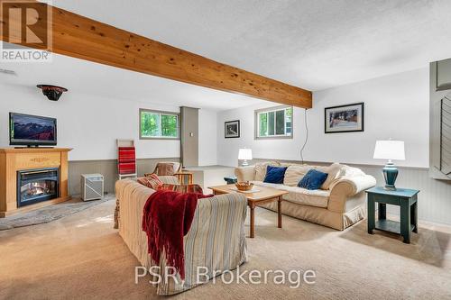 1047 Sands Road, Muskoka Lakes, ON - Indoor Photo Showing Living Room With Fireplace