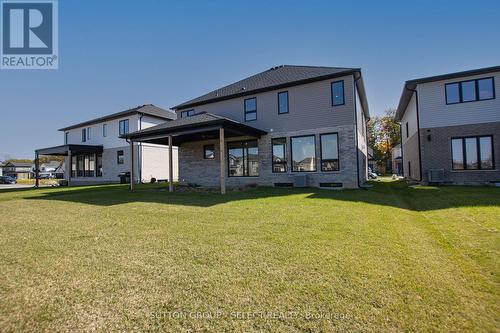 Rear of house with covered area - 88 Optimist Drive, Southwold (Talbotville), ON - Outdoor With Deck Patio Veranda