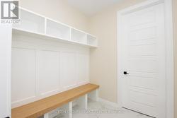 Mudroom with cubbies off garage - 