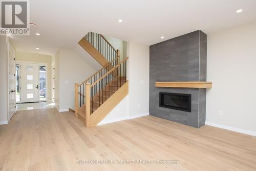 88 Optimist Drive, Southwold (Talbotville), ON - Indoor Photo Showing Living Room With Fireplace