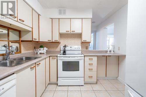 105 - 5280 Lakeshore Road, Burlington, ON - Indoor Photo Showing Kitchen With Double Sink