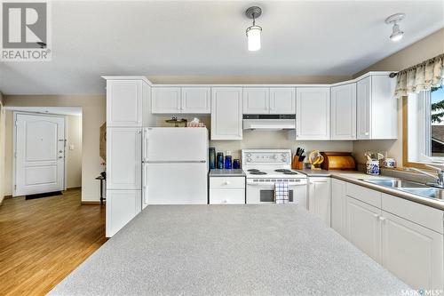 202 205 Mcintyre Street N, Regina, SK - Indoor Photo Showing Kitchen With Double Sink