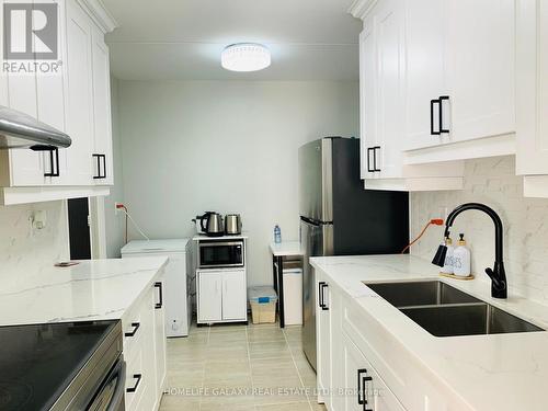 213 - 2 Glamorgan Avenue, Toronto, ON - Indoor Photo Showing Kitchen With Double Sink