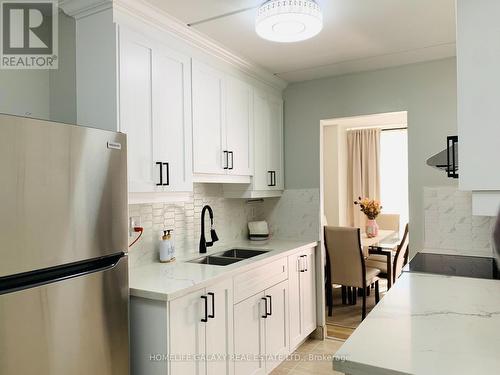 213 - 2 Glamorgan Avenue, Toronto, ON - Indoor Photo Showing Kitchen With Double Sink