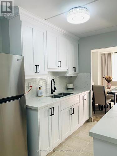 213 - 2 Glamorgan Avenue, Toronto, ON - Indoor Photo Showing Kitchen With Double Sink