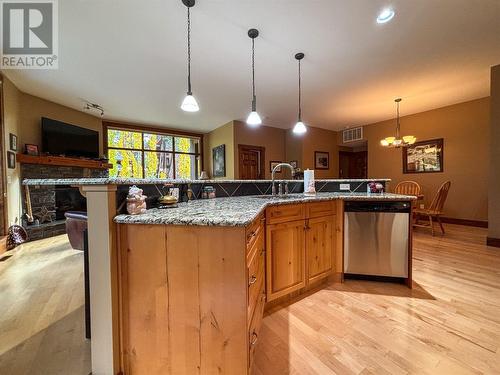 880 Lakeview Drive Drive Unit# 109, Windermere, BC - Indoor Photo Showing Kitchen With Fireplace