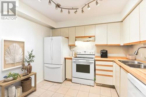 310 - 3845 Lake Shore Boulevard W, Toronto, ON - Indoor Photo Showing Kitchen With Double Sink