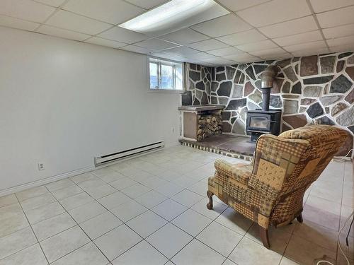 Family room - 12 Rue Lavallée, Lorrainville, QC - Indoor Photo Showing Other Room With Fireplace